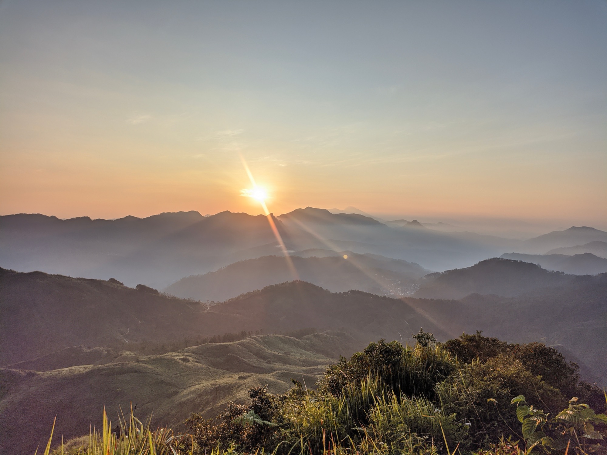 Sunrise over the highlands of the Philippines, where YourKalinga advocates are based.